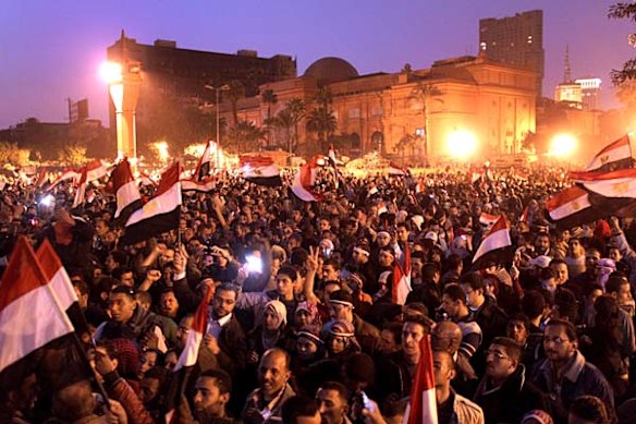 Anti-government demonstrators celebrate in Tahrir Square, Cairo after President Hosni Mubarak steps down.