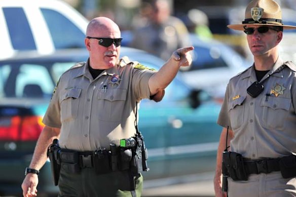 Police investigating the shooting of US congresswoman Gabrielle Giffords and 17 others.