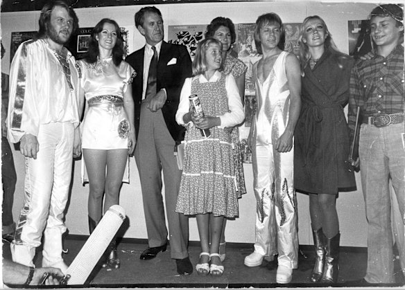 Australian Prime Minister Malcolm Fraser and his family [wife Tamie and their daughter and son] meet the Swedish pop group ABBA before the concert backstage at the Sidney Myer Music Bowl in Melbourne. 05-03-1977. 