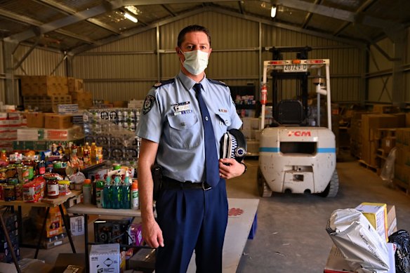 Assistant commissioner Brett Grenntree at the Wilcannia food distribution centre. The police are playing a major role in assisting the Wilcannia community through a COVID outbreak.