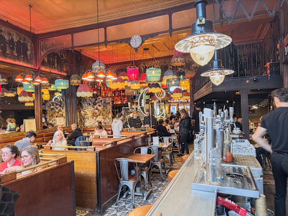 Diners enjoying a meal in bustling brasserie Cafe Charbon, where the writer’s love of the Ménilmontant neighbourhood began.
