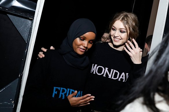 Model of the moment Halima Aden shares a moment with Gigi Hadid before walking in the Alberta Ferretti show.