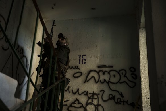 A Ukrainian serviceman in a building near a front-line position in Kharkiv.