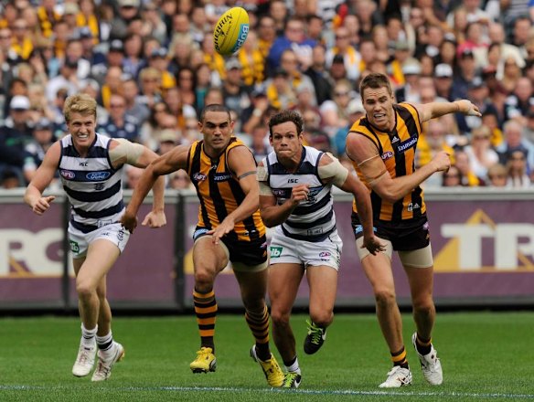 Josh Caddy [Geelong], Shaun Burgoyne [Hawthorn], Steven Motlop [G] and Max Bailey [H] dash for the ball.