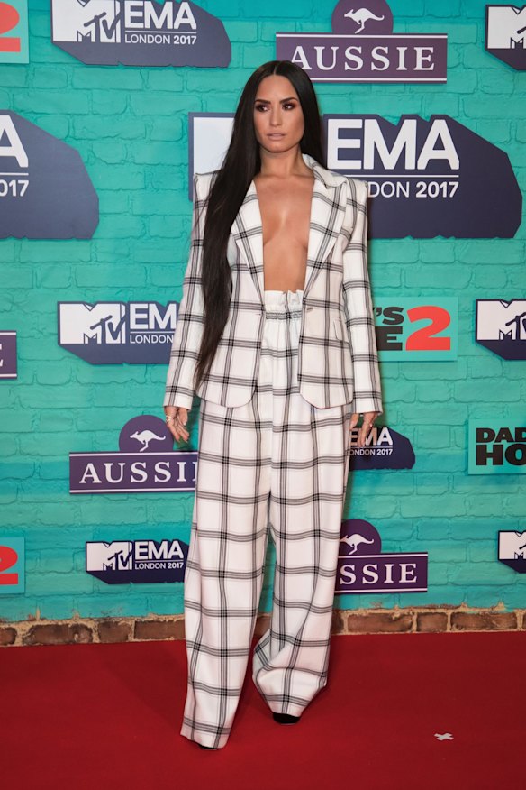 Just when you though the trend was being rested on red carpets, Demi Lovato opted for a suit co-ord without a top underneath. 