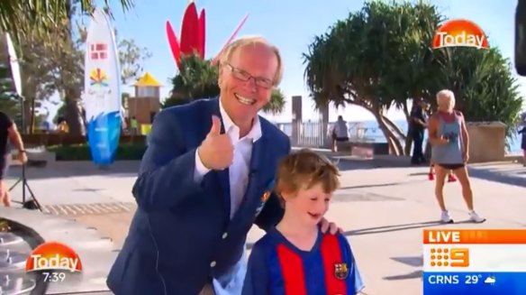Peter Beattie rubs shoulders with a young "Knights" fan.
