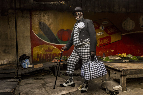 Yamea, 58, who has been a sapeur for half a century, brings colour and joie de vivre to his community. He has nine children and works as a brick-layer. His favourite item of clothing is his hat.