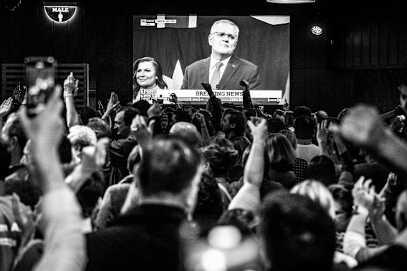 Labor supporters watch Prime Minister Scott Morrison concede defeat.