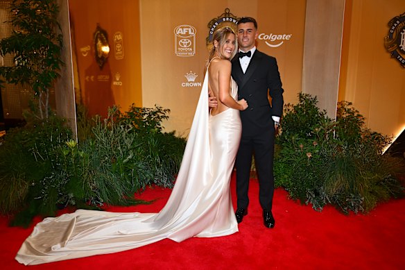 Nick Daicos of the Collingwood Magpies and partner Arlette Amor.