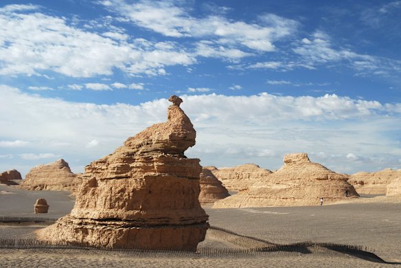 The prevailing winds carve stone 'yardangs' in the desert near Dunhuang. Photo: Conrad Walters.