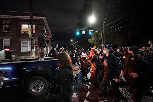 People march on the night of the election, in Portland, Oregon.