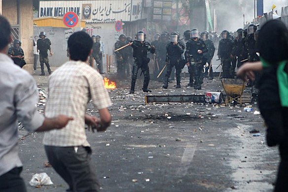 In this photograph posted on the internet, Iranian riot police clash with demonstrators in Tehran, Iran Saturday June 20, 2009.