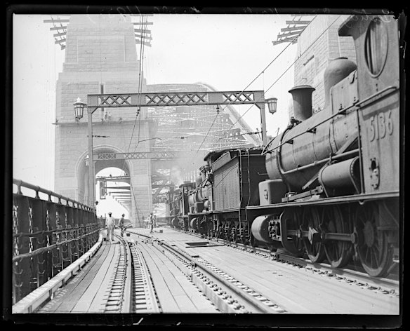 A steam train on the Harbour Bridge during construction in 1930.