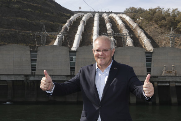 Prime Minister Scott Morrison poses for photos during a visit to the Snowy Hyrdo Tumut 3 power station in Talbingo, NSW. The site is near where the additional power lines will be needed to connect the pumped hydro plant to the grid.