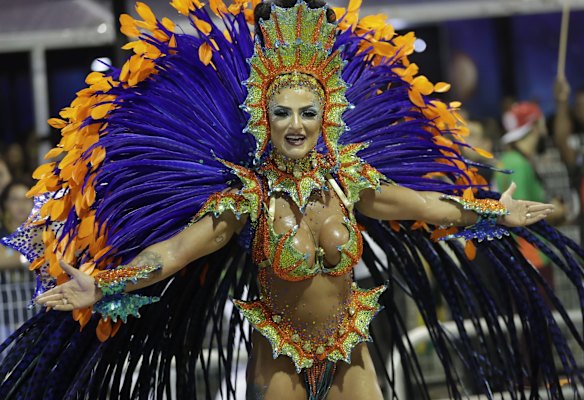 A dancer from the Mocidade Alegre samba school performs during a Carnival parade in Sao Paulo, Brazil.