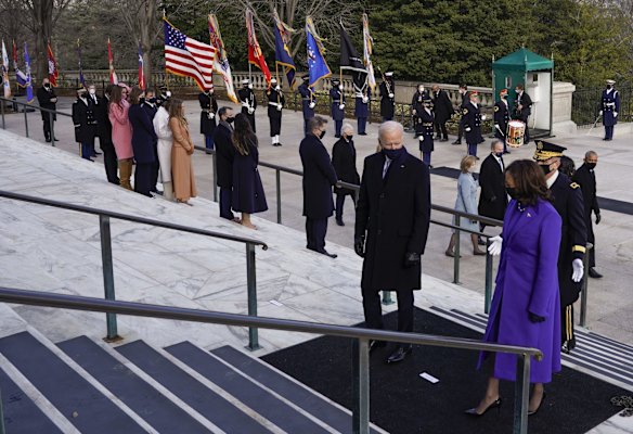 President Joe Biden and Vice President Kamala Harris and Maj. Gen. Omar J. Jones attend a wreath laying at the Tomb of the Unknown Soldier at the Arlington National Cemetery, in Arlington, Va., Wednesday, Jan. 21, 2021.