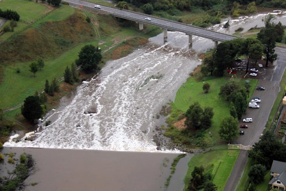 Water surges past the Marsden Flyover.