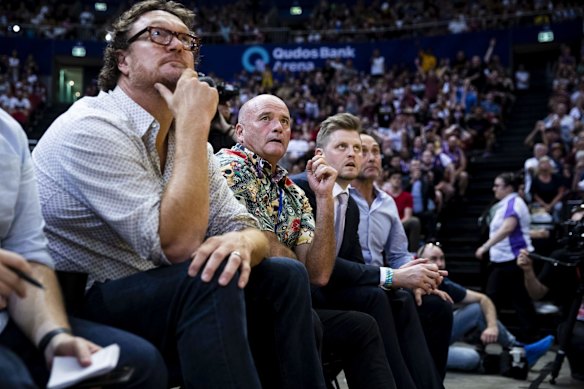 Paul Smith and Luc Longley look up at the scoreboard.