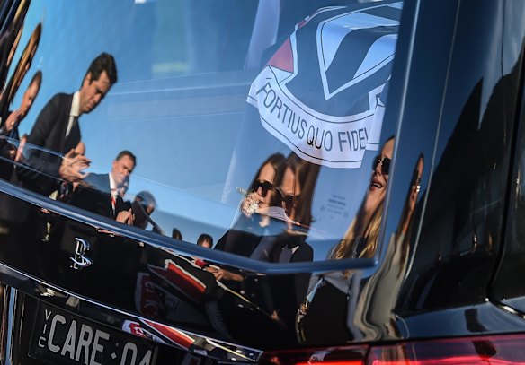 Reflections of family and AFL CEO Gil McLachlin in the back of the hearse.