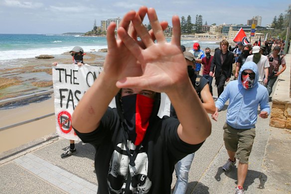 A man who didn't want to be photographed from the anti-racism rally during the march along the beach in Cronulla.