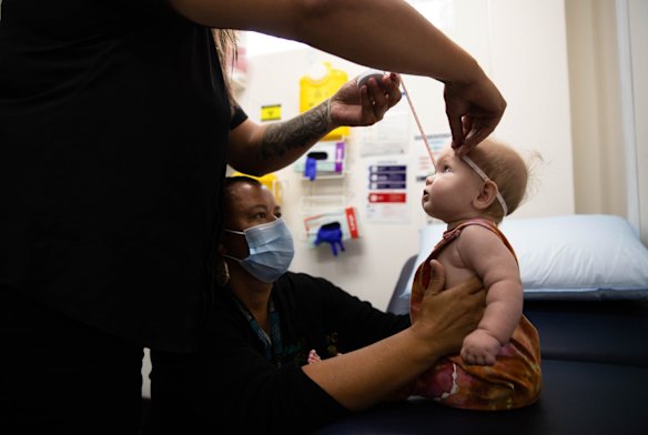 Mel Briggs and Georgie Resch carry out baby checks at Waminda.
