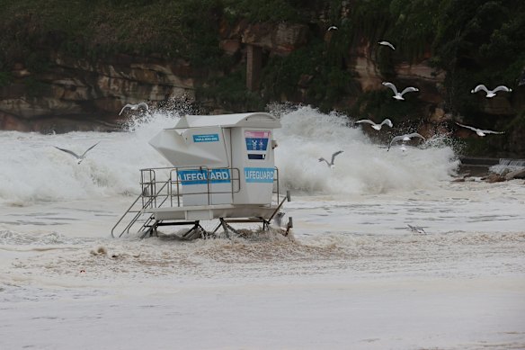 The lifeguard stand is swamped during high tide at Bondi Beach.