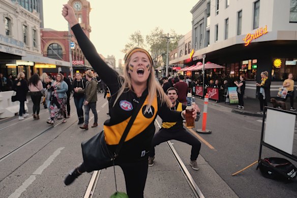 Richmond supporters celebrating their teams win over Adelaide during the AFL Grand Finals in Swan st Richmond.  Photo Luis Enrique Ascui