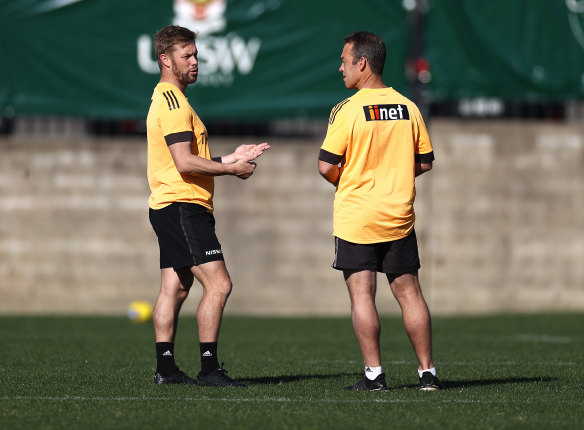 Former premiership Hawk Sam Mitchell with coach Alastair Clarkson.