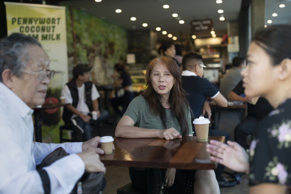 Vi Pham at a cafe in Marrickville with friends Van and Thuy.