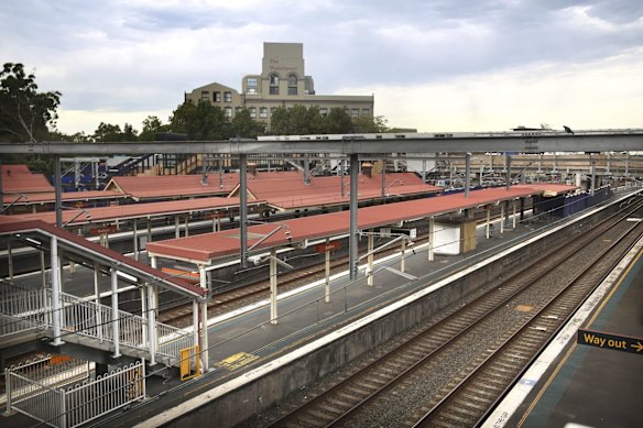 Empty platforms and closed railway entrances at Redfern Station on Monday.