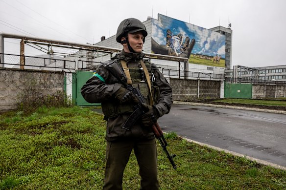 A Ukrainian army soldier stands guard at the Chernobyl Nuclear Power Plant in Chernobyl. Staff from the International Atomic Energy Agency (IAEA) visited Chernobyl on the 36th anniversary in the world's worst civilian nuclear incident. They were to bring equipment, make assessments and recommend safeguards to help prevent the possibility of a nuclear accident during the current conflict in Ukraine. Russian forces occupied the plant and the surrounding area in the weeks following its Feb. 22 invasion of Ukraine, subsequently withdrawing its forces into bordering Belarus after a failed attempt to seize the capital, Kyiv, to the south.