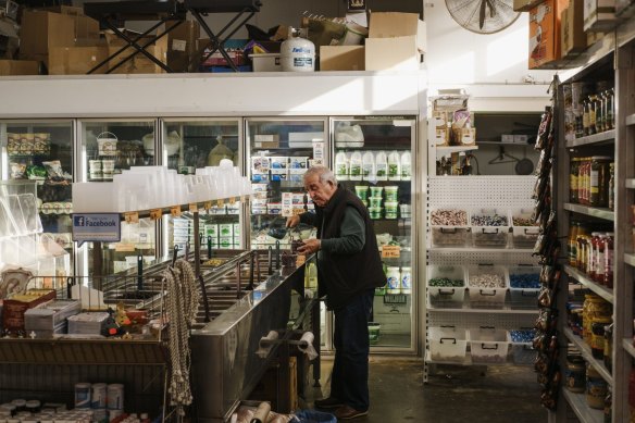 A customer peruses the various produce available at the Valley View Continental Spices shop.