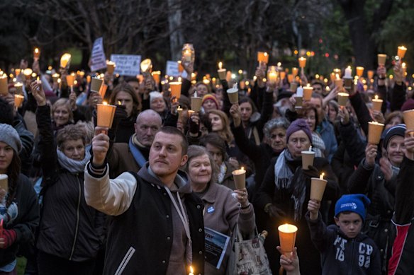People are seen at the Light The Dark: Melbourne says Welcome candlelight vigil for refugees at Treasury Gardens on September 7, 2015 in Melbourne, Australia. 