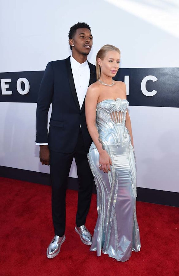 THE UNUSUAL BUT STILL GOOD: Here's Aussie rapper Iggy Azalea with her basketball player boyf' Nick Young. Now, Iggy looks stunning in this Versace dress, yes, but the more we stare at the dress' details the more we think it looks like a girly Transformer car pre-transformation ... or some kind of ice throwing Marvel superhero's shield. And yet she still manages to make it look good ... power to her ... that colour is amazing ...