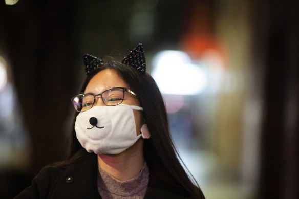 Facemasks and distance are the new normal in Chinatown.