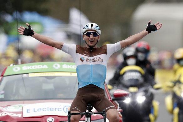 France's Nans Peters celebrates as he crosses the finish line to win the eighth stage of the Tour de France.