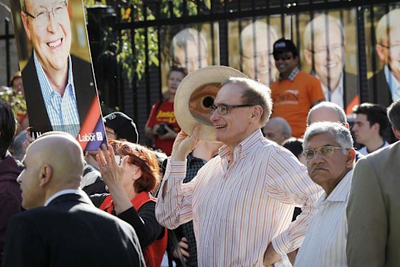 Senator Bob Carr listens to Prime Minister Kevin Rudd addresses a campaign rally in Westmead, Sydney.