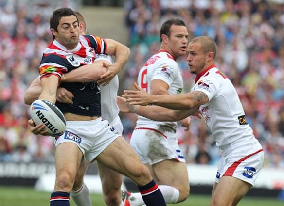 The Roosters Anthony Minichiello looks to offload. 