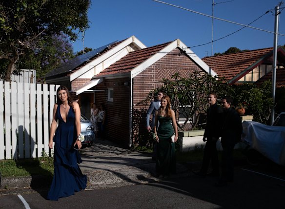 Rose Bay Secondary College student Elsie Gillezeau leaving home with her friends to go to their school formal at Doltone House. "I hadn’t danced in quite a long time, because you can't have parties. This was my first experience of that [since COVID-19], which gives me hope."

