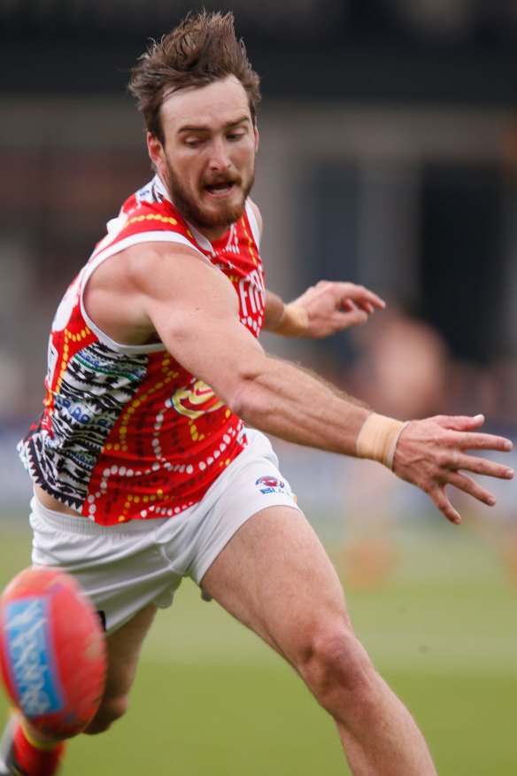 LAUNCESTON, AUSTRALIA - MAY 30:  Charlie Dixon of the Suns chases the ball during the round nine AFL match between the Hawthorn Hawks and the Gold Coast Suns at Aurora Stadium on May 30, 2015 in Launceston, Australia.  (Photo by Darrian Traynor/Getty Images)