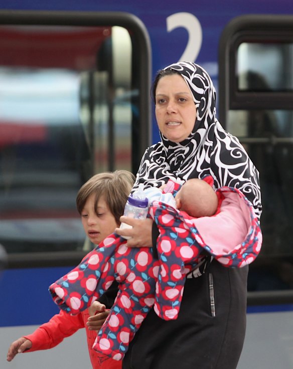 Migrants arrive from Austria at Munich Hauptbahnhof main railway station in Munich, Germany.