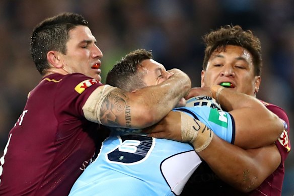Greg Bird of the Blues is tackled.