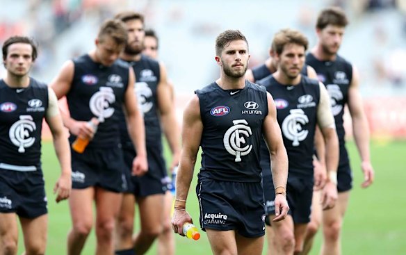 Carlton captain Marc Murphy leads his team off the field after their loss.