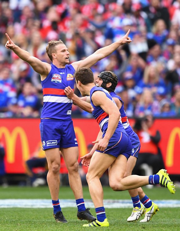 MELBOURNE, AUSTRALIA - OCTOBER 01: Jake Stringer of the Bulldogs celebrates kicking a goalduring the 2016 AFL Grand Final match between the Sydney Swans and the Western Bulldogs at Melbourne Cricket Ground on October 1, 2016 in Melbourne, Australia. (Photo by Quinn Rooney/Getty Images)
