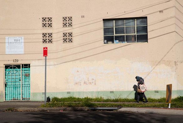 A pedestrian in Punchbowl during lockdown in Sydney. The Canterbury-Bankstown LGA is a hotspot during the latest Covid-19 outbreak, and the residents have tighter restrictions than elsewhere in Sydney.