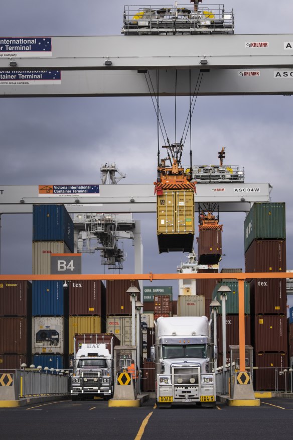 A computer-controlled crane loads a truck at the Victorian International Container Terminal at the Port of Melbourne.