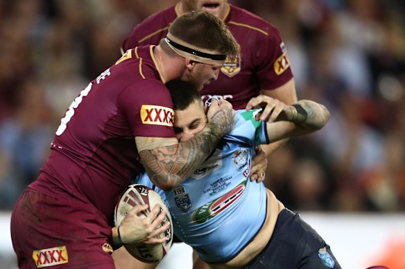 Jack Bird of the Blues is tackled.