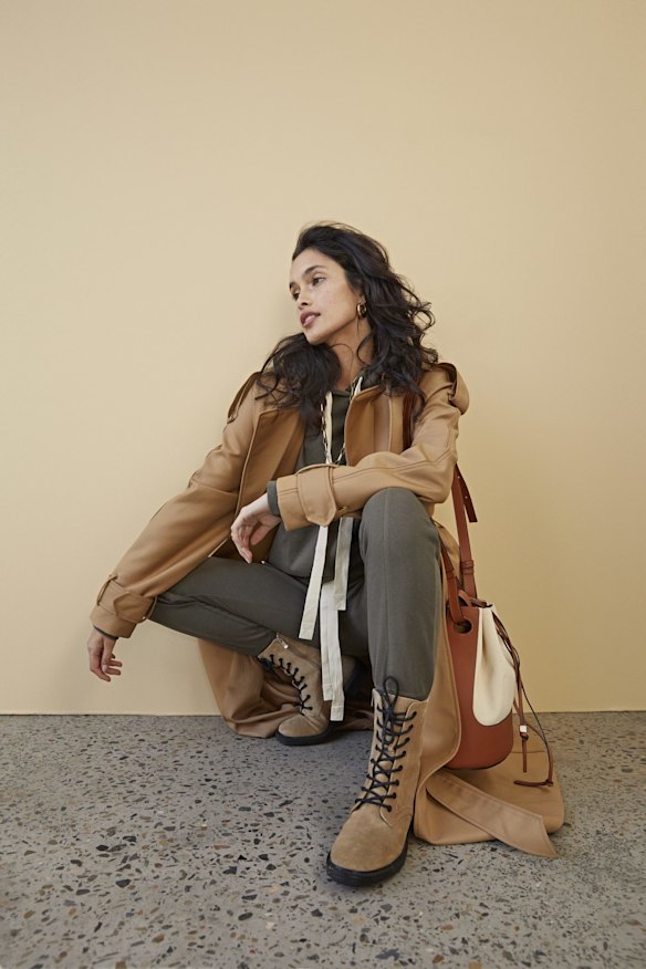 Camilla and Marc “Bobbie” coat, $750. Lee Mathews “Vince” hoodie, $269, and track pants, $329. Reliquia “Coralia” earrings, $139. Loewe bag, $3850. Zara boots, $169. 