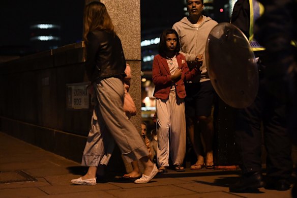 People are lead to safety on Southwark Bridge away from London Bridge after an attack.