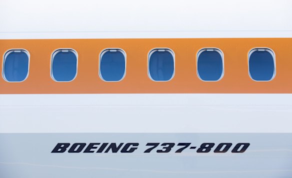 The '70s themed aircraft, featuring an ochre band from tip to tail, signifying the airline's outback roots.